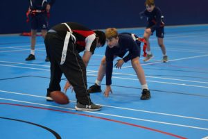 children playing rugby indoors