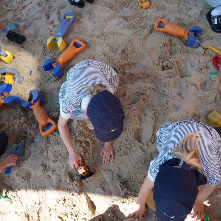 children playing in a sand pit