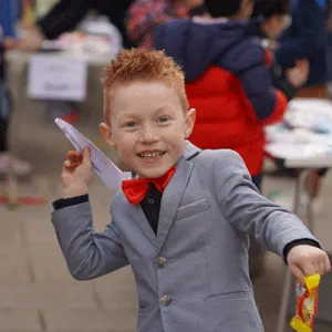 boy throwing a paper plane