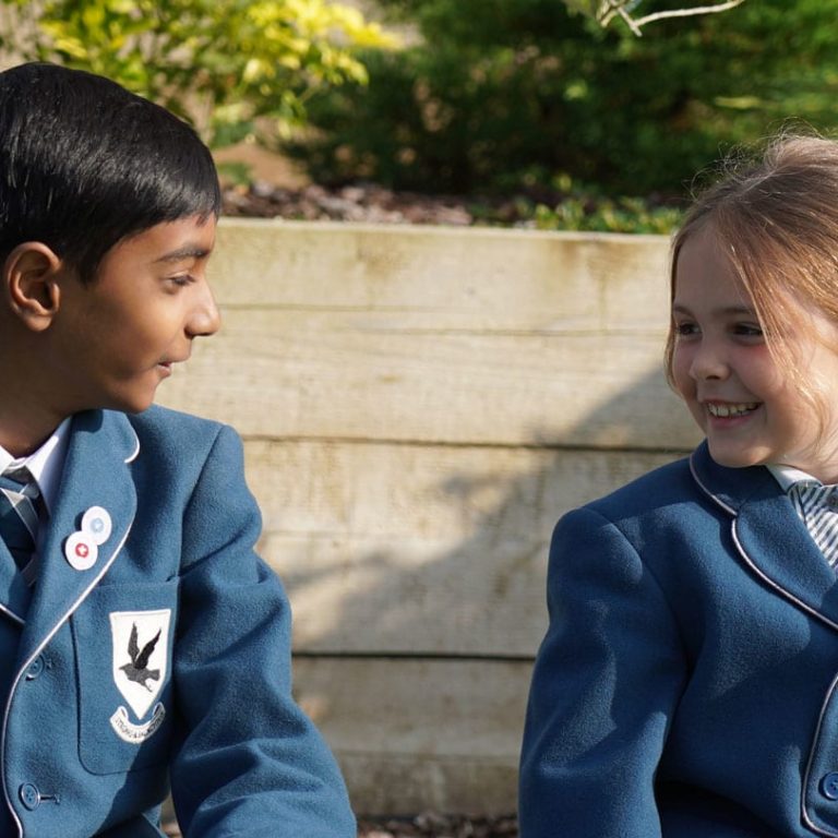 students smiling at each other