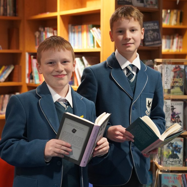 boys holding books