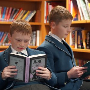 boys holding books