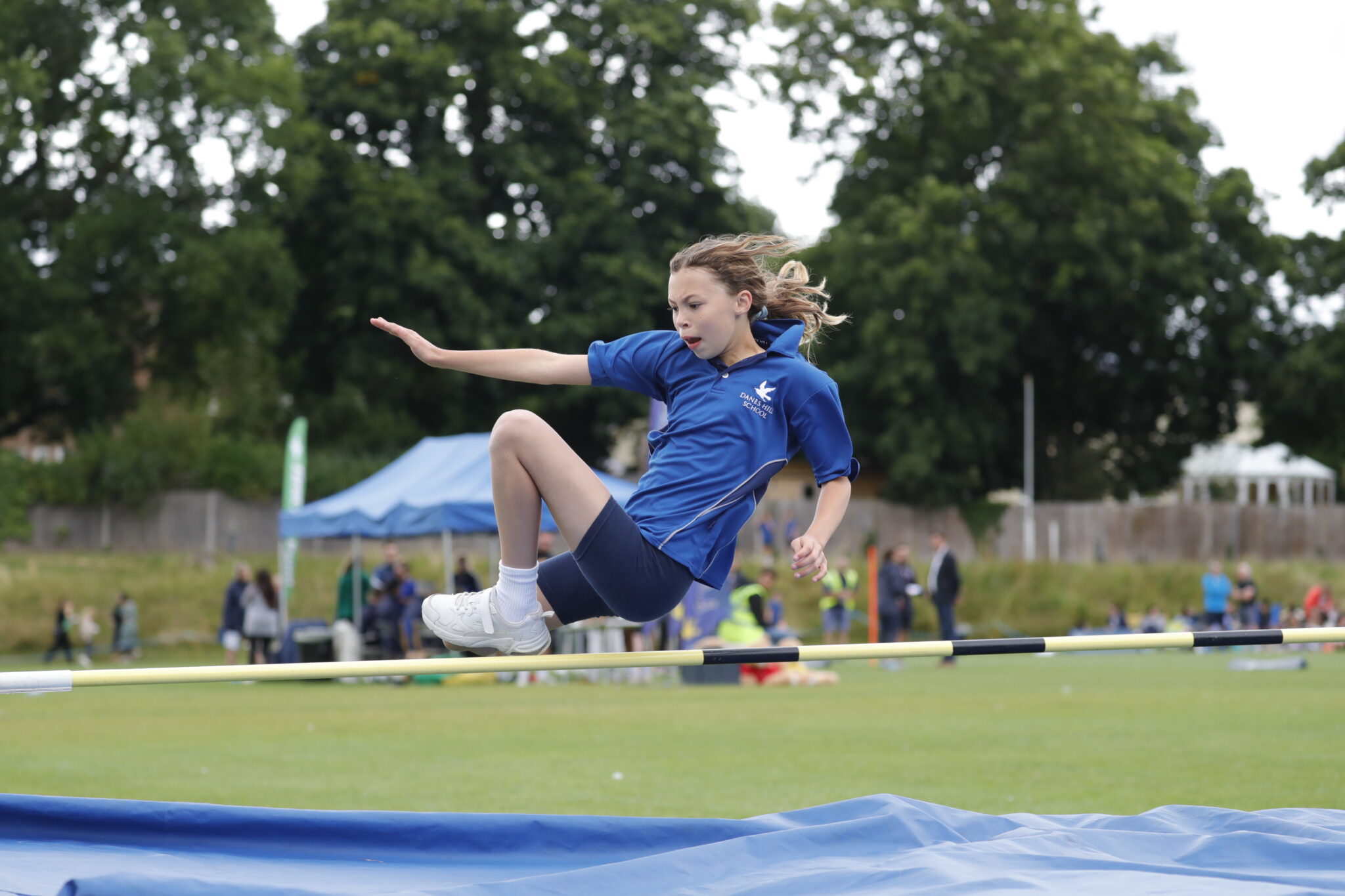 girl doing long jump