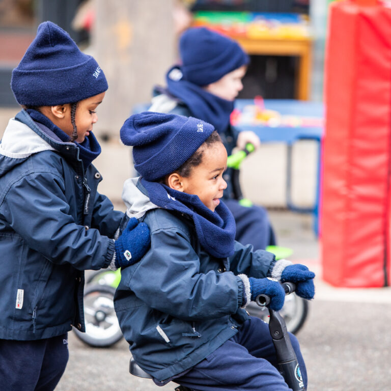 pre prep students playing on bikes