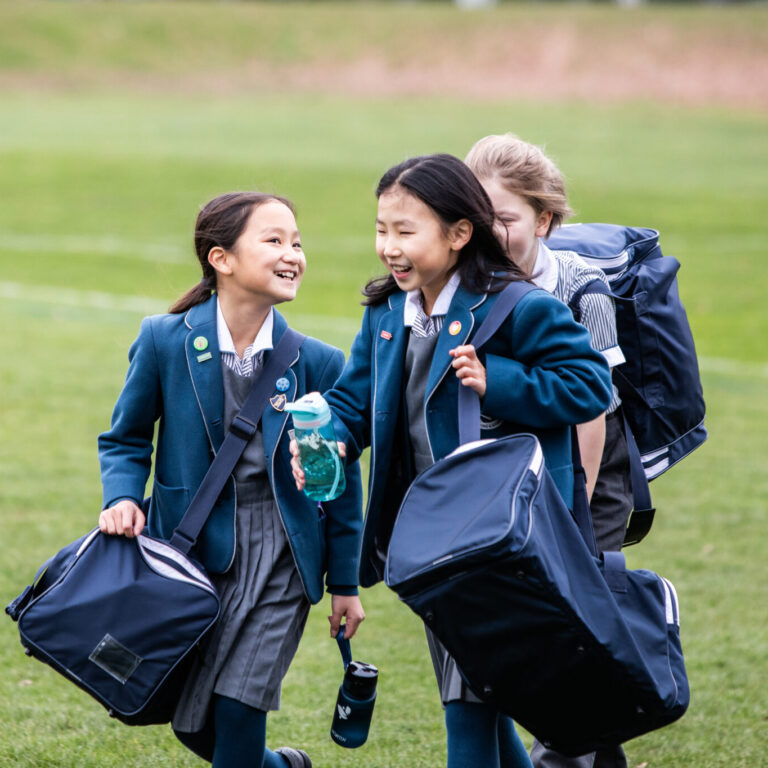 students holding their pe kits